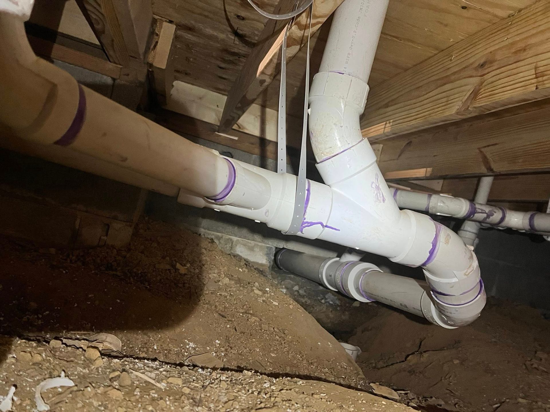 Professional PVC drain line work in crawl space